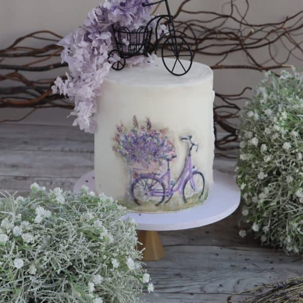 Lavender-Bicycle-Cake-2.5kg-–-550-AED-3kg-–-650-AED.jpg Lavender Bicycle Cake - Image 1